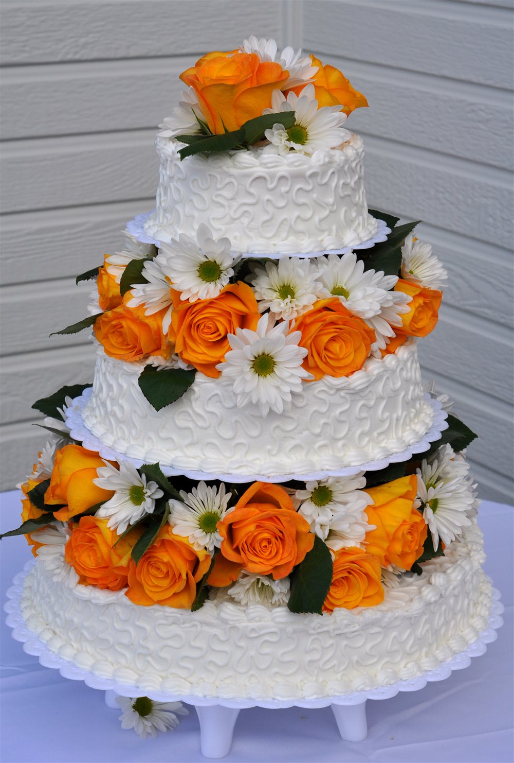 Three-tier celebration cake with flowers